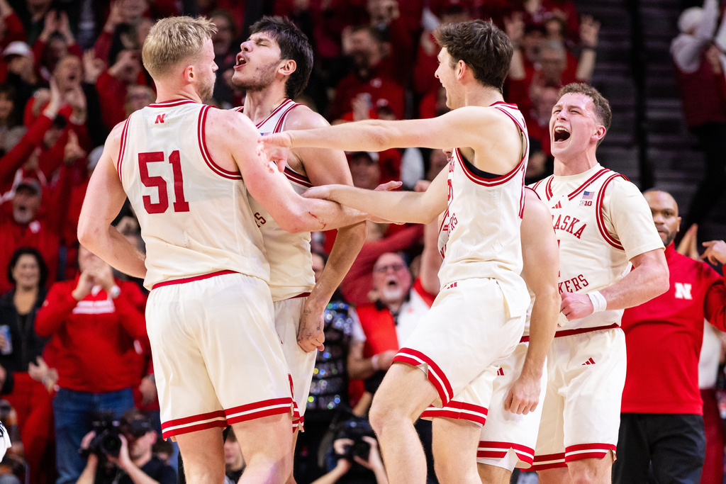 Nebraska forwards Rienk Mast (51), Berke Büyüktuncel (9), Pryce Sandfort (21) and guard Cale Jacobsen (31) celebrate a basket against Michigan State during the first half of an NCAA college basketball game, Friday, Jan. 2, 2026, in Lincoln, Neb. (AP Photo/Bonnie Ryan)