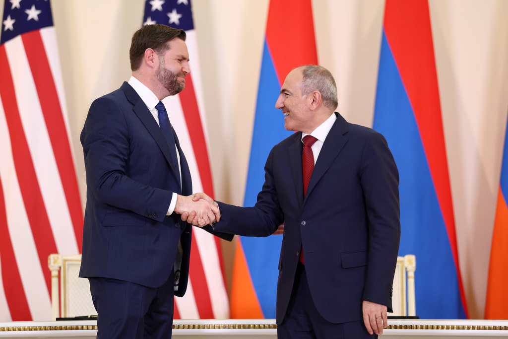 U.S. Vice President JD Vance and Armenia's Prime Minister Nikol Pashinyan shake hands, as they attend a joint press conference, in Yerevan, Armenia, Monday, Feb. 9, 2026. (Kevin Lamarque/Pool Photo via AP)