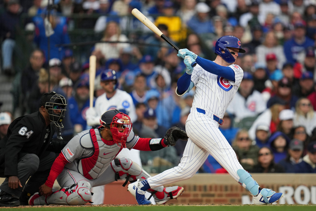 Chicago Cubs center fielder Pete Crow-Armstrong (4) hits a one-run single during the third inning of an opening-day baseball game against the Washington Nationals, Thursday, March 26, 2026, in Chicago. (AP Photo/Erin Hooley)