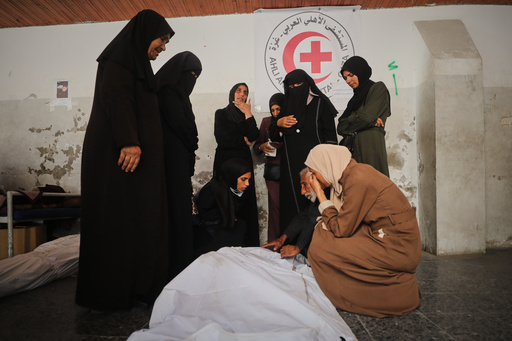 Mourners gather around the bodies of Palestinians, killed by Israeli fire after crossing the ceasefire line according to the Hamas-run Civil Defense, as they brought to Al Ahli Hospital in Gaza City, Saturday, Oct. 18, 2025. (AP Photo/Yousef Al Zanoun) Mourners gather around the bodies of Palestinians, killed by Israeli fire after crossing the ceasefire line according to the Hamas-run Civil Defense, as they brought to Al Ahli Hospital in Gaza City, Saturday, Oct. 18, 2025. (AP Photo/Yousef Al Zanoun)