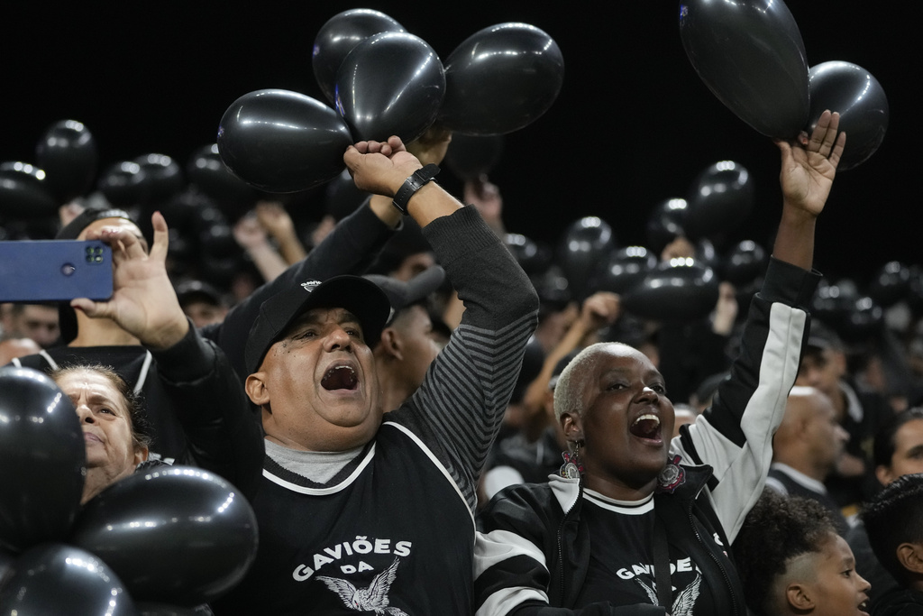 FILE - Fans cheer on Brazil's Corinthians during a Copa Sudamericana Group F soccer match against Argentina's Argentinos Juniors at Neo Quimica Arena in Sao Paulo, Brazil, May 14, 2024. (AP Photo/Andre Penner, File)