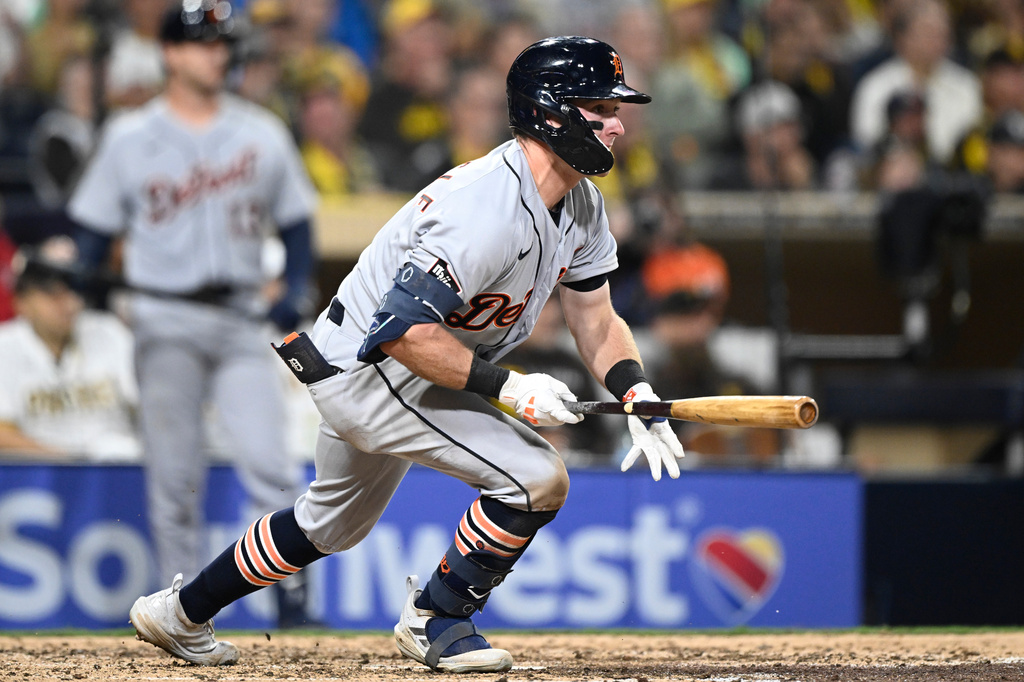 Detroit Tigers' Kevin McGonigle (7) hits an RBI single during the eighth inning of a baseball game against the San Diego Padres Friday, March 27, 2026, in San Diego. (AP Photo/Denis Poroy)