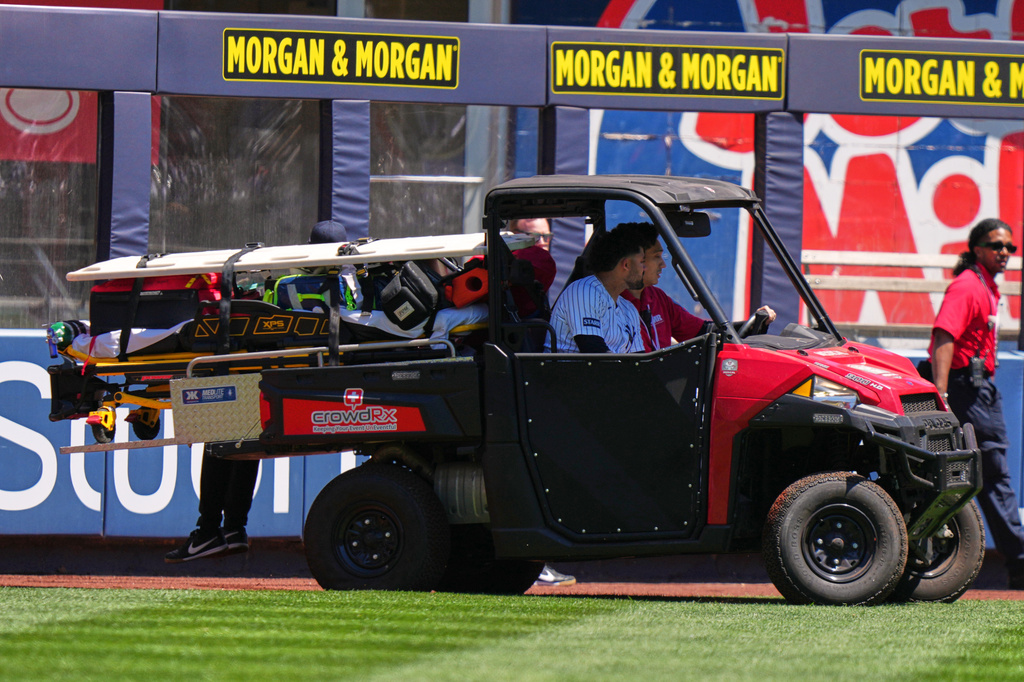 New York Yankees' Jasson Domínguez is carted off the field after an injury during the first inning of a baseball game against the Texas Rangers Thursday, May 7, 2026, in New York. (AP Photo/Frank Franklin II)
