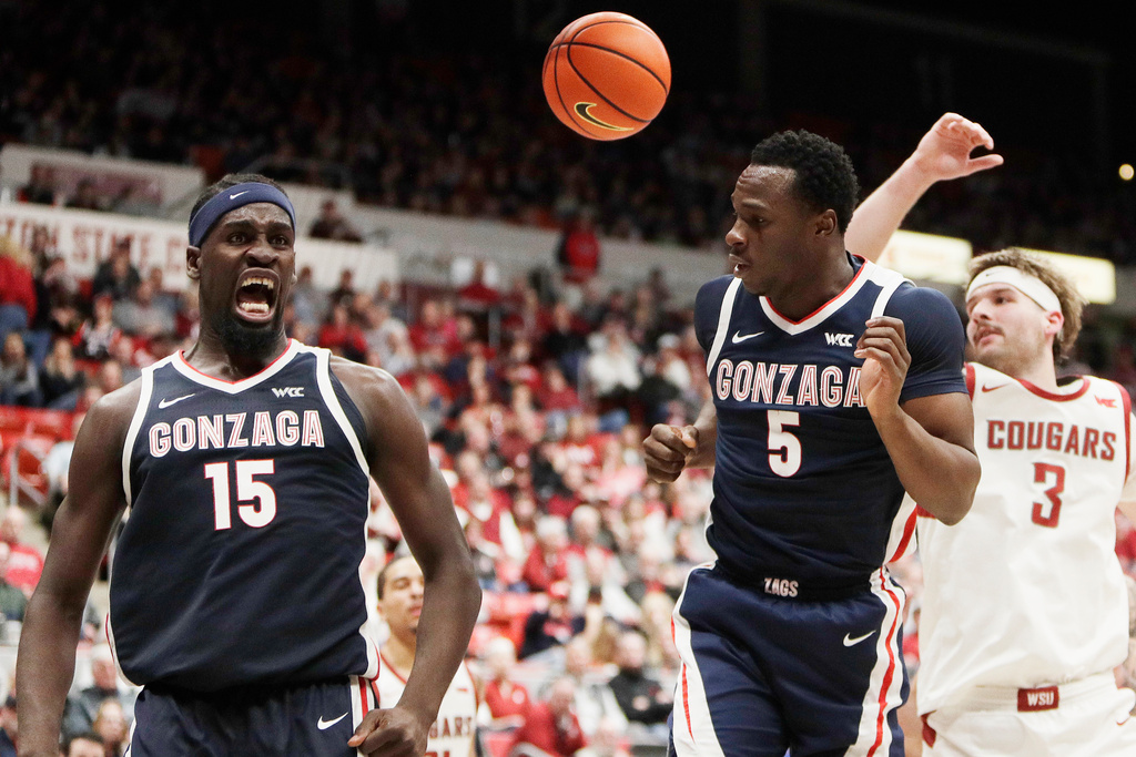 Gonzaga forward Graham Ike (15) reacts after scoring a basket next to teammate Emmanuel Innocenti (5) during the second half of an NCAA college basketball game against Washington State, Thursday, Jan. 15, 2026, in Pullman, Wash. (AP Photo/Young Kwak)