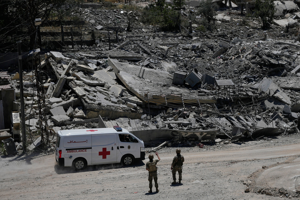 Lebanese soldiers deploy at a road in front of destroyed houses in Dibbine village, southeast Lebanon, Friday, June 5, 2026, a day after Israeli forces withdrew following clashes with Hezbollah fighters. (AP Photo/Hussein Malla)