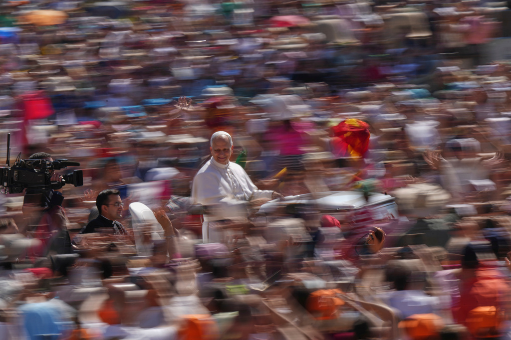 FILE - Pope Leo XIV arrives on his pope mobile before celebrating a Mass for the Jubilee of Families in St. Peter's Square, at the Vatican, June 1, 2025. (AP Photo/Andrew Medichini, File)