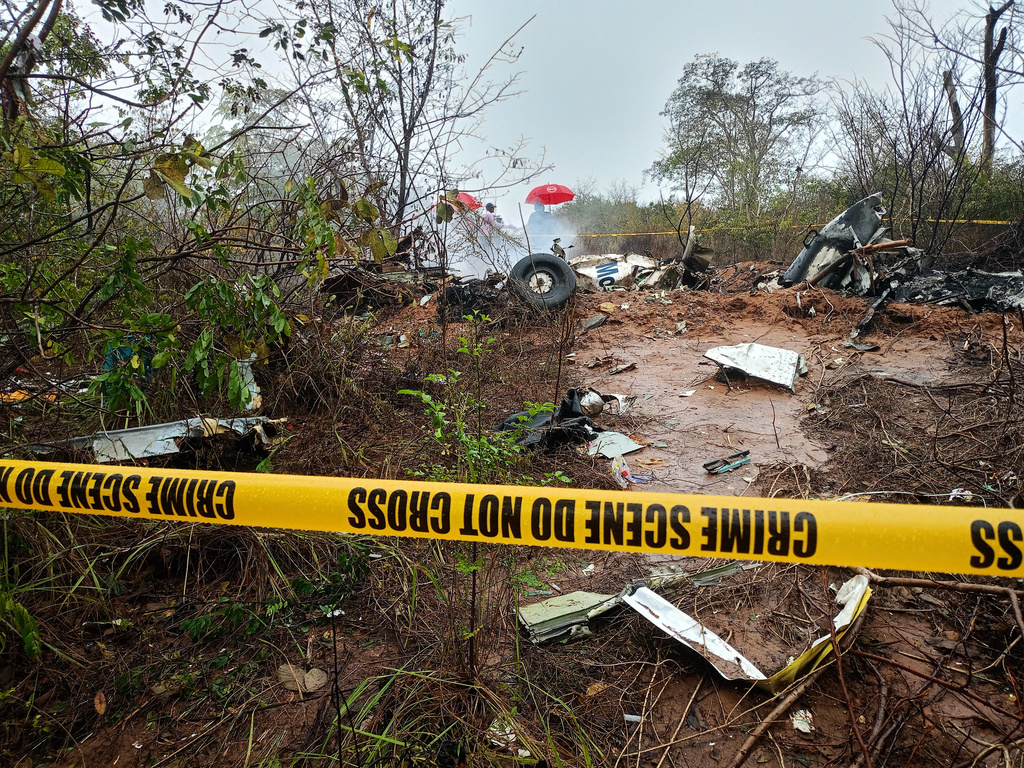 Kenyan officials inspect the scene of a plane crash near Diani, Kenya, Tuesday, Oct. 28, 2025. (AP Photo)
