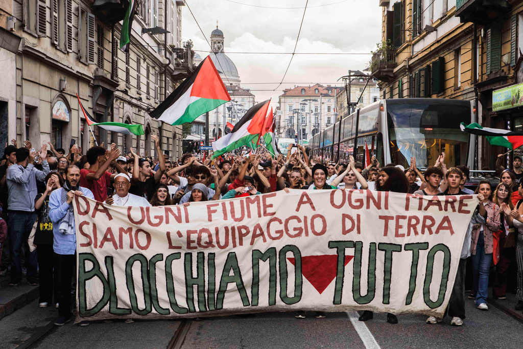 FILE - People protest during a nationwide transport, port, and school strike against the killing of Palestinians in Gaza, in Turin, Italy, on Sept. 22, 2025. (Andrea Alfano/LaPresse via AP, File)