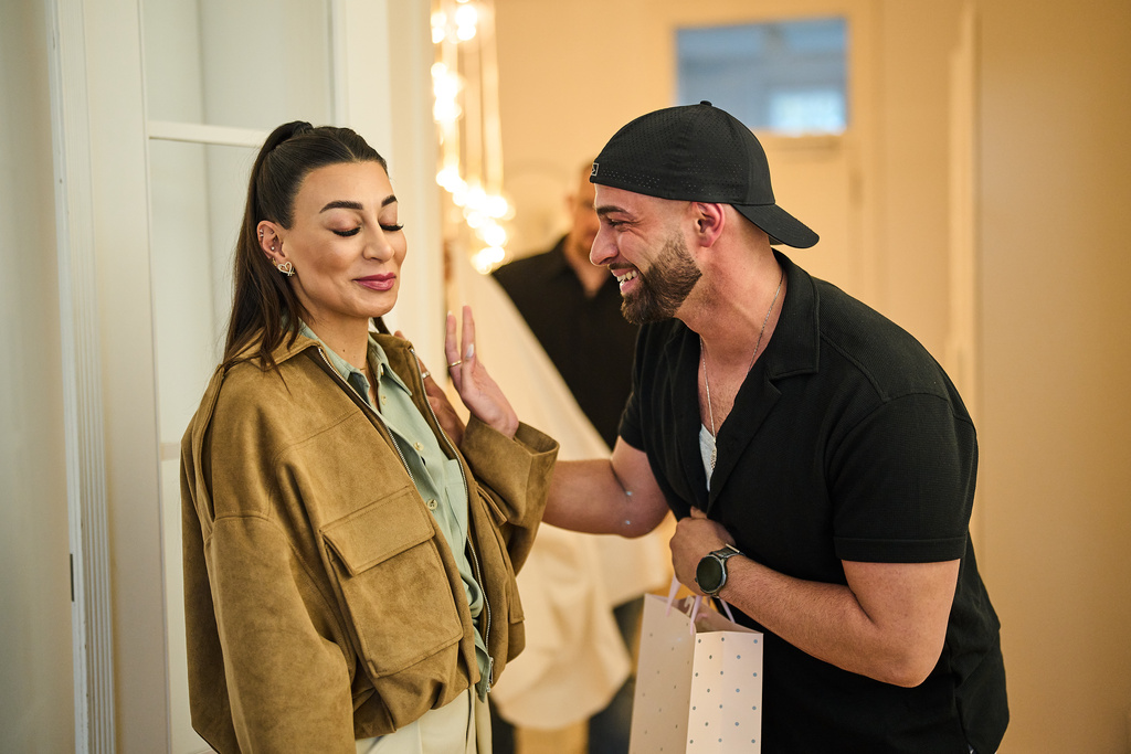 Gay Muslim influencer Ali Darwich, right, welcomes friends for an inclusive Iftar, the Ramadan fast-breaking meal, with friends who are Muslim, Christian, queer and straight, in Berlin, Germany, Wednesday, March 11, 2026. (AP Photo/Ebrahim Noroozi)