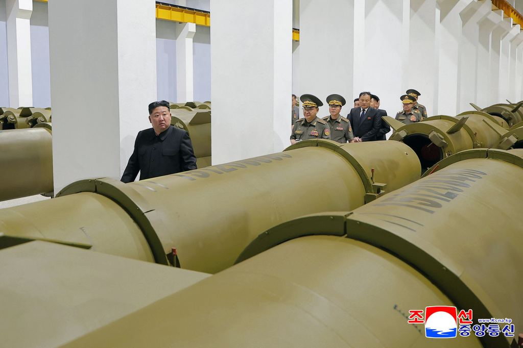 In this photo provided by the North Korean government, its leader Kim Jong Un, left, visits a weapons factory at an undisclosed place in North Korea Saturday, June 6, 2026. Independent journalists were not given access to cover the event depicted in this image distributed by the North Korean government. The content of this image is as provided and cannot be independently verified. Korean language watermark on image as provided by source reads: "KCNA" which is the abbreviation for Korean Central News Agency. (Korean Central News Agency/Korea News Service via AP)