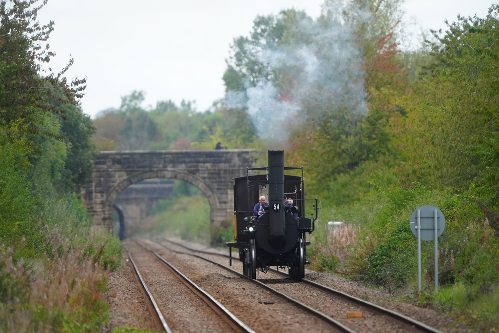 Replica Locomotion No1 approaches Heighington station, County Durham, Friday, Sept. 26, 2025, on its first official journey in 200 years from the Locomotion Museum in Shildon to Darlington, as part of celebrations marking the 200th anniversary of British passenger rail services. (Owen Humphreys/PA via AP)