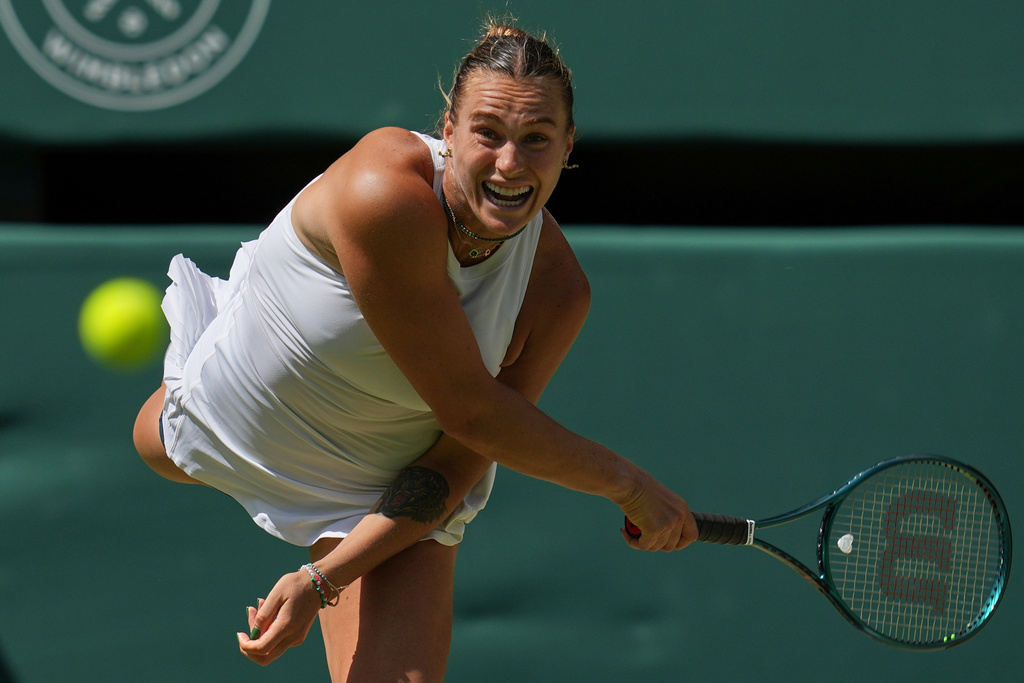 FILE - Aryna Sabalenka of Belarus serves to Amanda Anisimova of the U.S. during a women's singles semifinal match at the Wimbledon Tennis Championships in London, Thursday, July 10, 2025. (AP Photo/Kin Cheung, file)