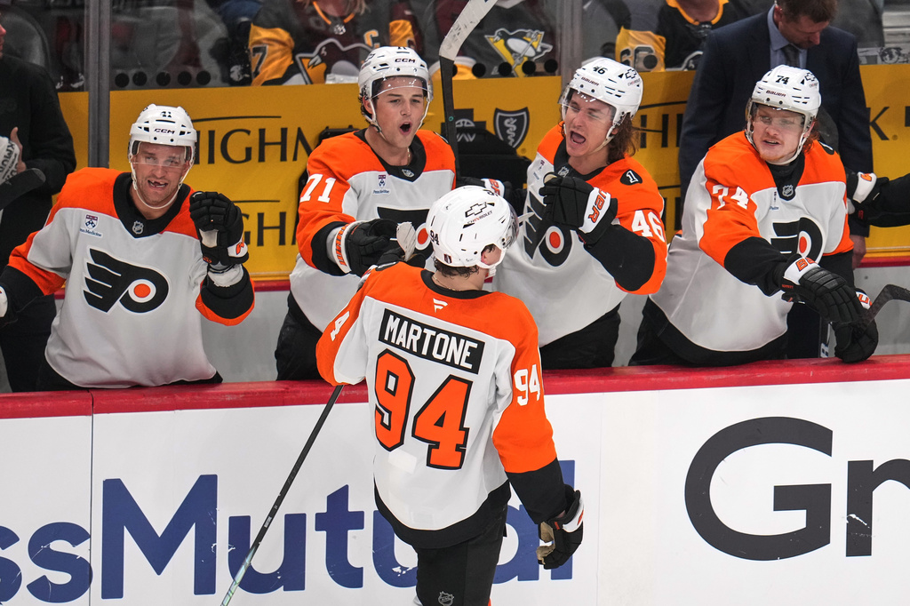Philadelphia Flyers' Porter Martone (94) returns to the bench after scoring during the third period of Game 1 in the first round of the NHL Stanley Cup playoffs against the Pittsburgh Penguins in Pittsburgh, Saturday, April 18, 2026. (AP Photo/Gene J. Puskar)