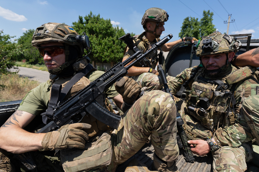 In this photo provided by Ukraine's 93rd Kholodnyi Yar Separate Mechanized Brigade press service, Soldiers of the Alcatraz batalion, patrol the frontline city Druzhkovka, Donetsk region, Ukraine, Thursday, July 2, 2026. (Iryna Rybakova/Ukraine's 93rd Mechanized Brigade via AP)