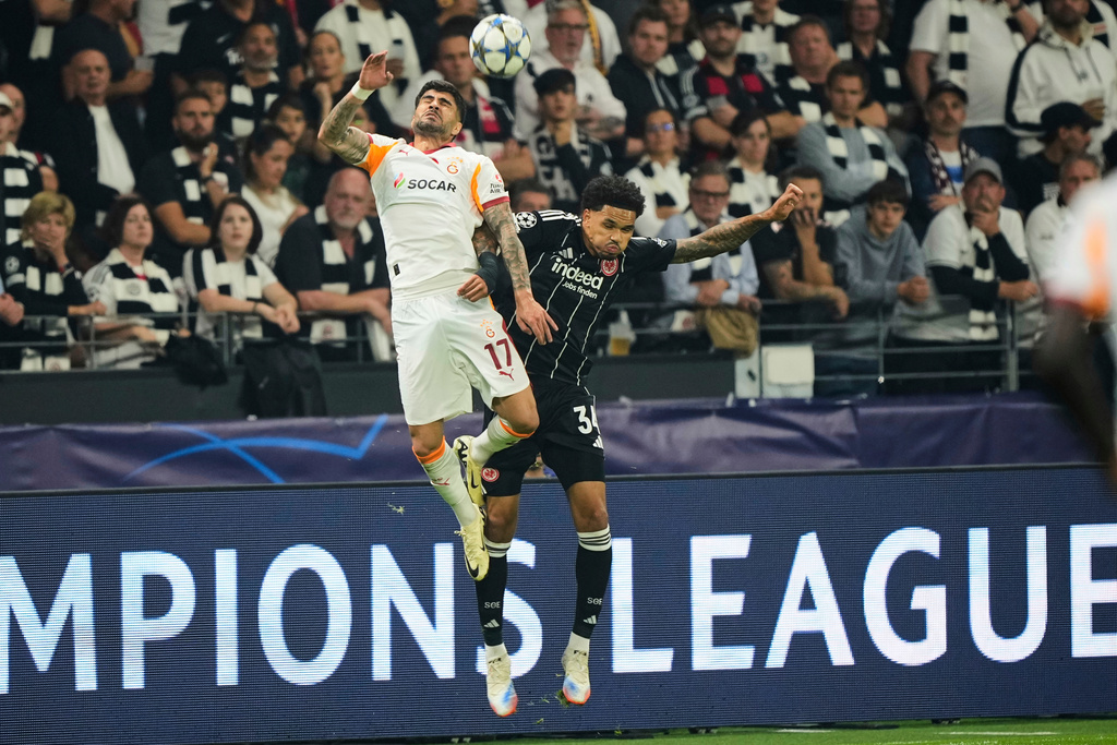 FILE - Galatasaray's Eren Elmali, left, and Frankfurt's Nnamdi Collins jump for a header during the Champions League opening phase soccer match between Eintracht Frankfurt and Galatasaray in Frankfurt, Germany, Thursday, Sept. 18, 2025. (AP Photo/Martin Meissner, File)