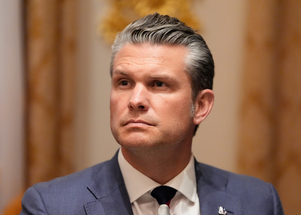 Defense Secretary Pete Hegseth listens as President Donald Trump speaks before a lunch with Ukraine's President Volodymyr Zelenskyy in the Cabinet Room of the White House, Friday, Oct. 17, 2025, in Washington. (AP Photo/Alex Brandon)