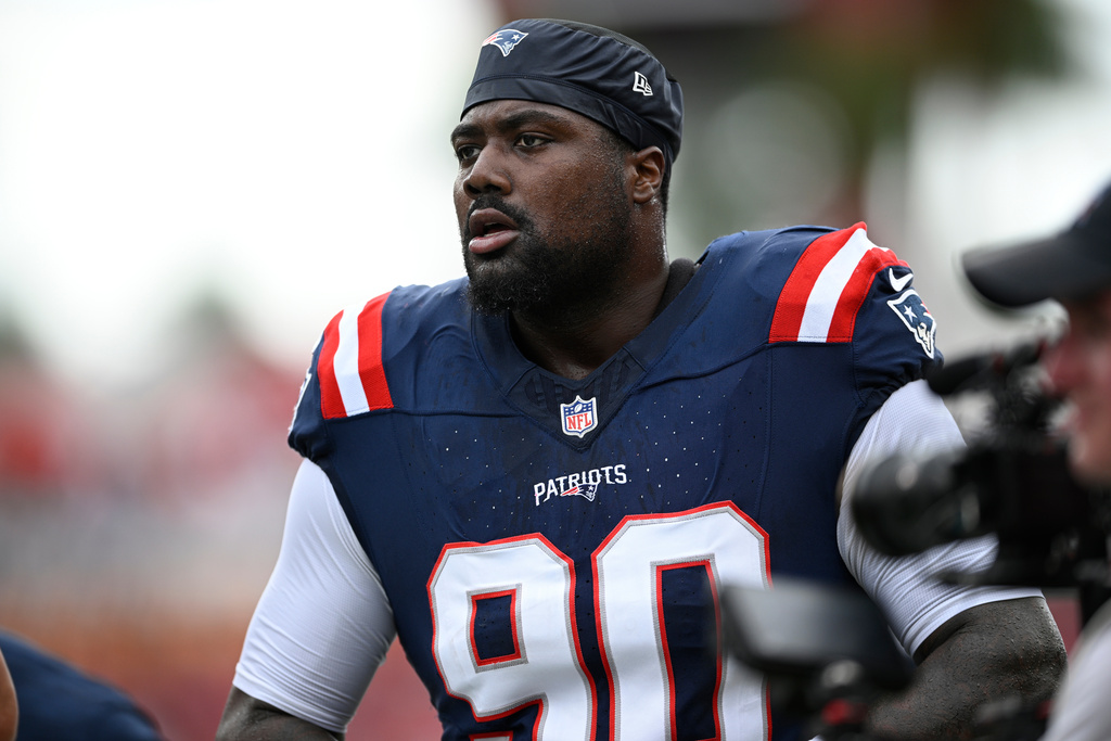 FILE - New England Patriots defensive tackle Christian Barmore (90) warms up before an NFL football game against the Tampa Bay Buccaneers, Sunday, Nov. 9, 2025, in Tampa, Fla. (AP Photo/Phelan M. Ebenhack, File)