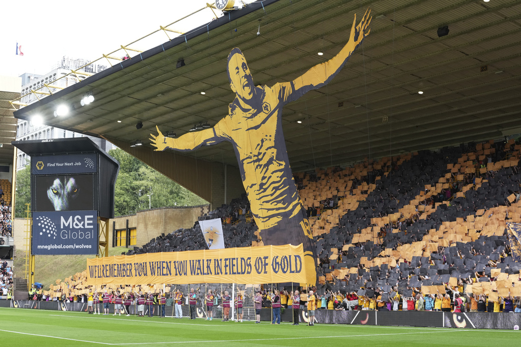 Fans pay a tribute to late Liverpool player Diogo Jota ahead of the English Premier League soccer match between Wolverhampton Wanderers and Manchester City at Molineux Stadium, Wolverhampton, England, Saturday, Aug. 16, 2025. (AP Photo/Dave Shopland)
