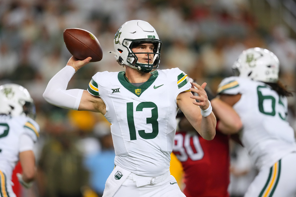 Baylor quarterback Sawyer Robertson throws a pass against Utah during the first half of an NCAA college football game Saturday, Nov. 15, 2025, in Waco, Texas. (AP Photo/Julio Cortez)