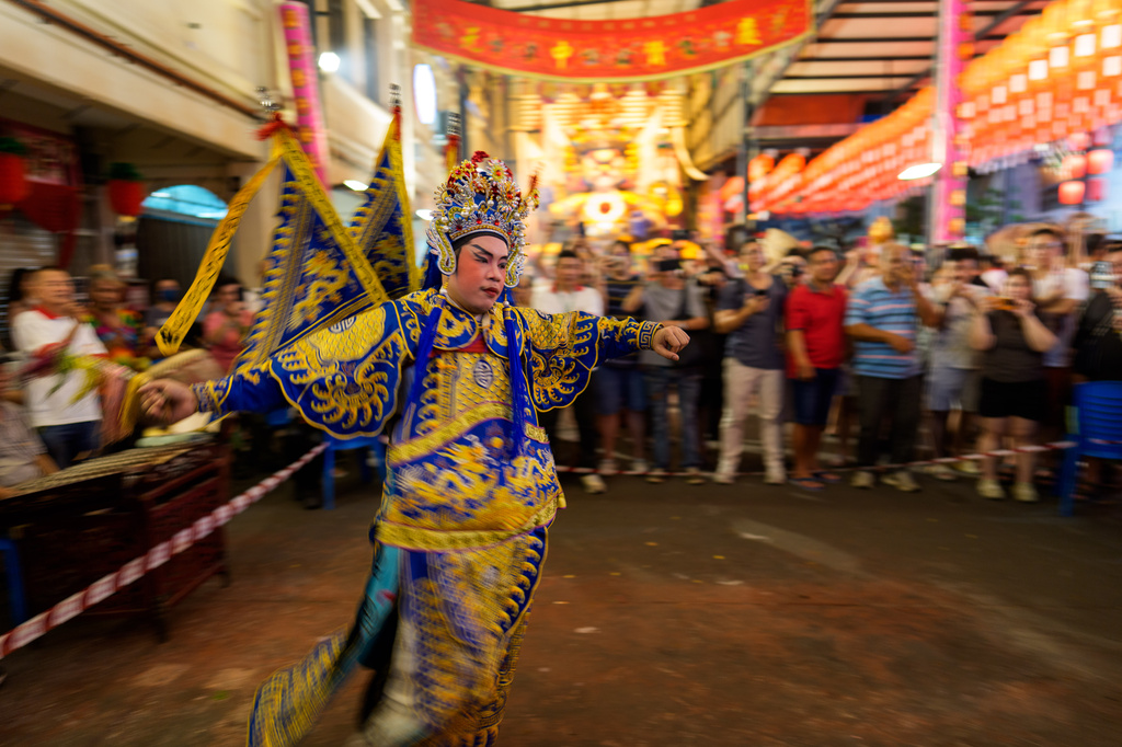 A Chinese opera performer takes part in a procession during the Hungry Ghost Festival in Bukit Metajam, Malaysia, Saturday, Aug. 29, 2026. (AP Photo/Vincent Thian)