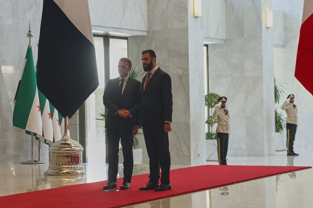 Syrian President Ahmad al-Sharaa meets French President Emmanuel Macron at the presidential palace in Damascus, Syria, Tuesday, July 7, 2026. (AP Photo/Ghaith Alsayed)