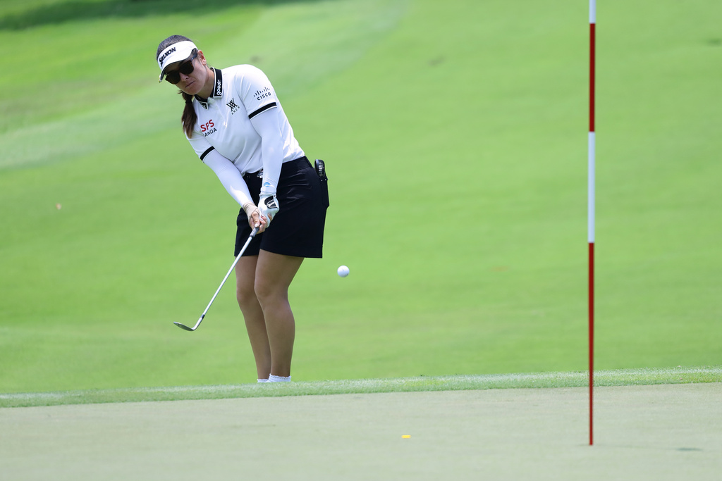Hannah Green of Australia plays her shot during the HSBC Women's World Championship at Sentosa Golf Club in Singapore, Sunday, March 1, 2026. (AP Photo/Suhaimi Abdullah)