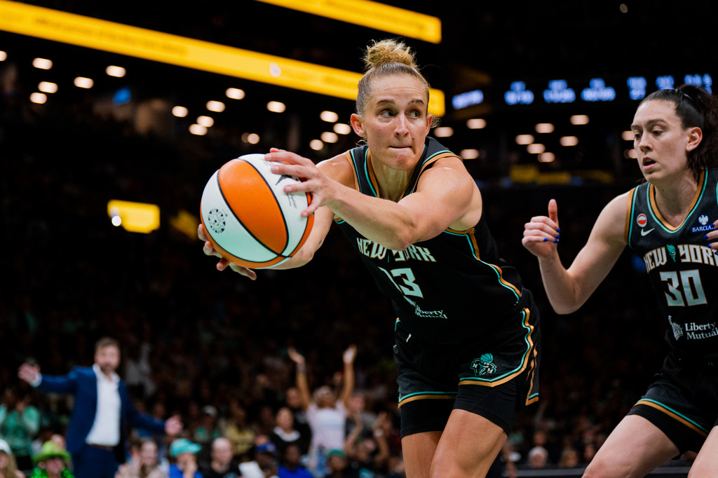 New York Liberty forward Leonie Fiebich (13) catches a rebound during the second half of a WNBA basketball game against the Indiana Fever, Saturday, Aug. 22, 2026, in New York. (AP Photo/Angelina Katsanis)