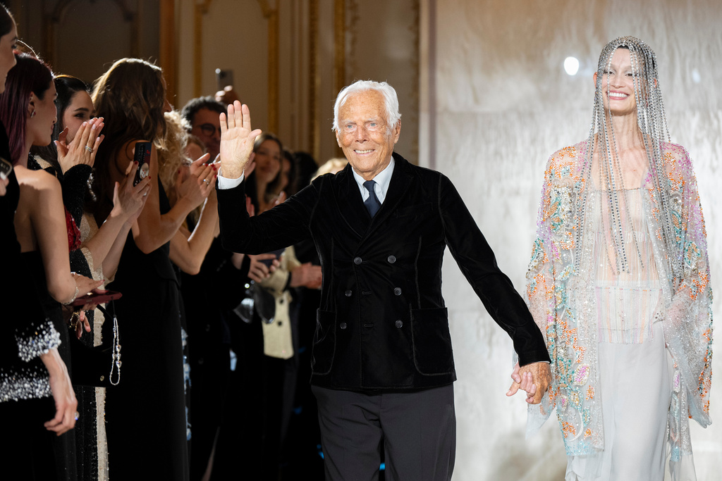 Giorgio Armani waves at the end of his Prive Haute Couture Spring/Summer 2025 collection in Paris, Jan. 28, 2025. (AP Photo/Lewis Joly, File)