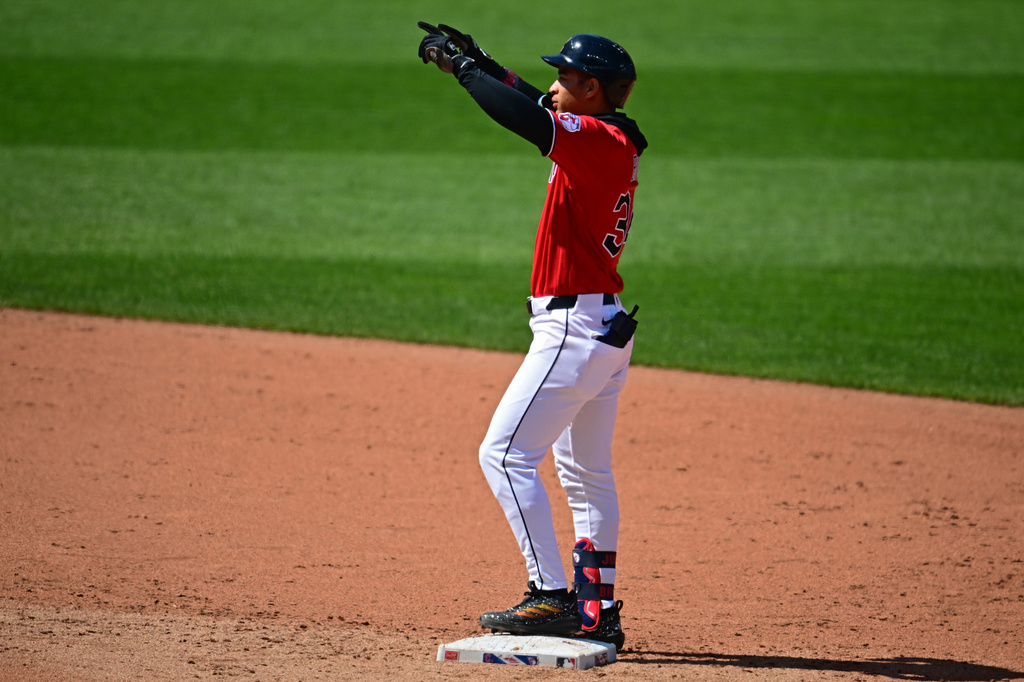 Cleveland Guardians' Juan Brito celebrates after hitting an RBI double during the fifth inning of a baseball game against the Kansas City Royals, Wednesday, April 8, 2026, in Cleveland. (AP Photo/David Dermer)