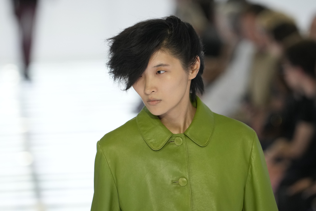 A model wears a creation from Prada's Spring/Summer 2027 men's collection presented in Milan, Italy, Sunday, June 21, 2026. (AP Photo/Luca Bruno)