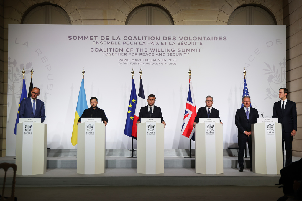 From the left, German Chancellor Friedrich Merz, Ukraine's President Volodymyr Zelenskyy, French President Emmanuel Macron, Britain's Prime Minister Keir Starmer, US Special Envoy Steve Witkoff and US businessman Jared Kushner attend a joint press conference after the signing of the declaration on deploying post-ceasefire force in Ukraine during the 'Coalition of the Willing' summit on security guarantees for Ukraine, at the Elysee Palace in Paris Tuesday, Jan 6, 2026. (Ludovic Marin, Pool photo via AP)