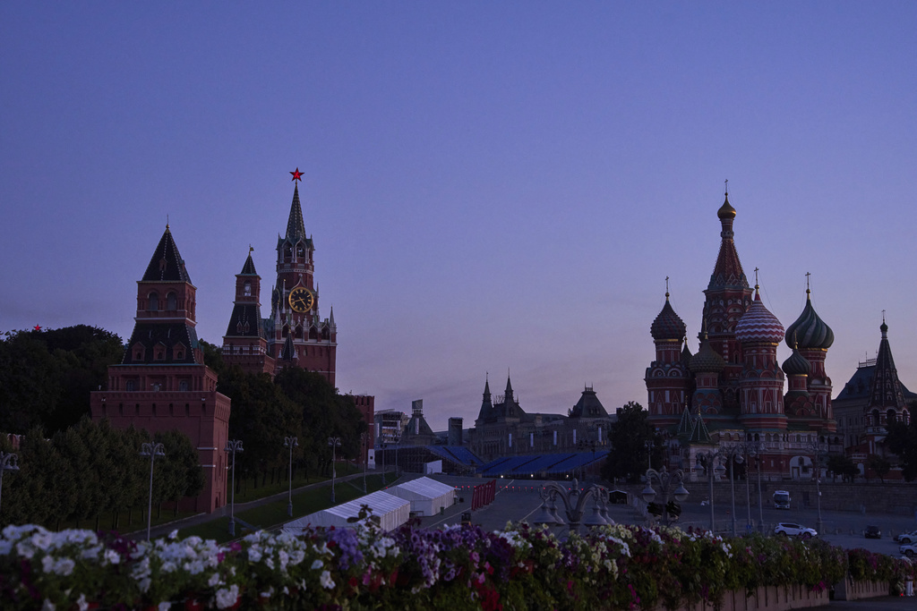 The Kremlin Wall, the Spasskaya Tower, second left, empty Red Square and St. Basil's Cathedral are seen in an early morning prior to sunrise in Moscow, Russia, on Saturday, Aug. 16, 2025. (AP Photo/Alexander Zemlianichenko)