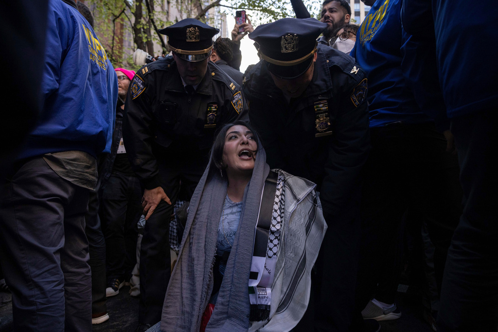 FILE - Police detain Nerdeen Kiswani, an organizer of pro-Palestinian demonstration group "Within Our Lifetime" during a protest, Friday, April. 12, 2024, in New York. (AP Photo/Yuki Iwamura, File)