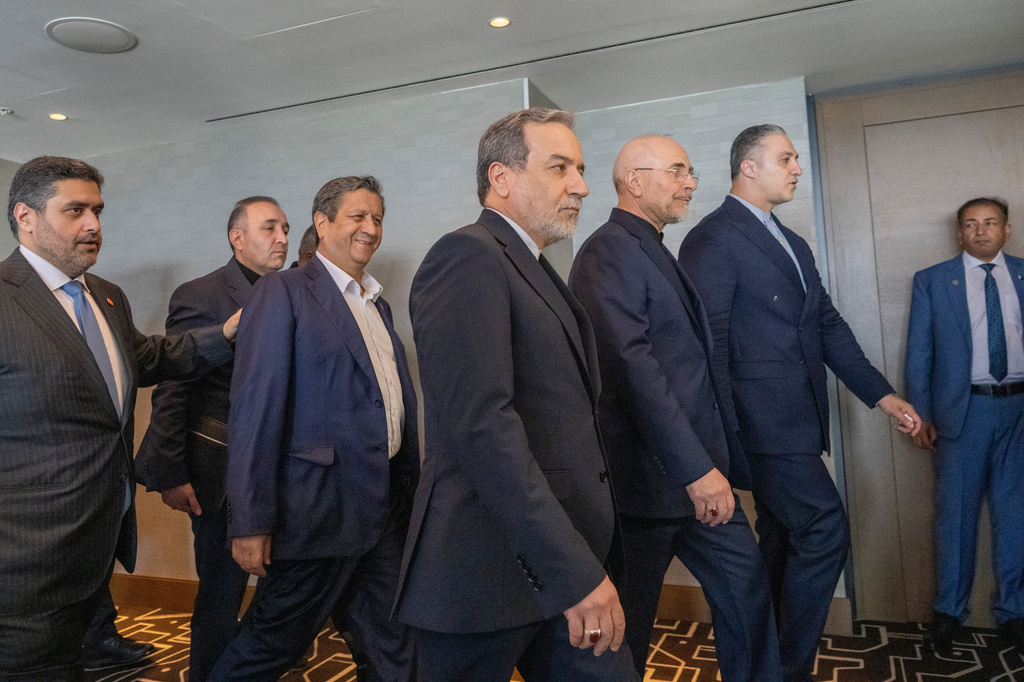 Minister of Foreign Affairs of Iran, Seyyed Abbas Araghchi, 3rd from right, and Speaker of the Islamic Parliament of Iran, Mohammed Bagher Ghalibaf, 2nd from right, with the Delegation of Iran at the Lake Lucerne Summit at the Buergenstock resort in Obbuergen, near Lucerne, Switzerland, Sunday, June 21, 2026. (Urs Flueeler, Pool Photo via AP)