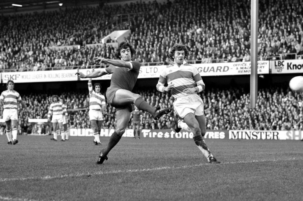 FILE - Liverpool striker Kevin Keegan gets a tremendous shot at goal despite the attentions of Ian Gillard, the Queen Park Rangers defender, during the English First Division match between Liverpool and Queens Park Rangers at Shepherds Bush on London on Oct. 19, 1974. (AP Photo/Smith, File)