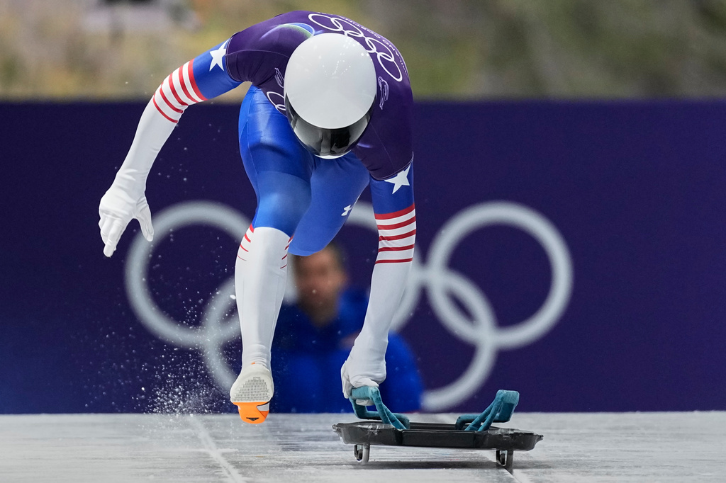 United State's Daniel Barefoot starts for a men's skeleton run at the 2026 Winter Olympics, in Cortina d'Ampezzo, Italy, Thursday, Feb. 12, 2026. (AP Photo/Aijaz Rahi)