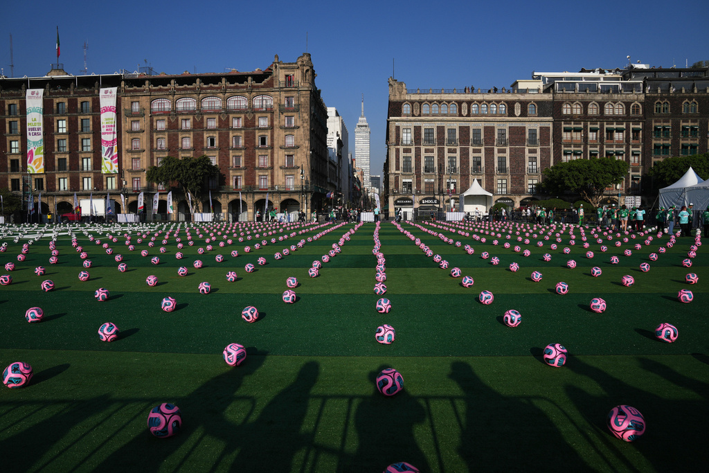 Soccer balls sit ahead of an event to set a Guinness World Record for the "largest soccer class" at the Zocalo in Mexico City, Sunday, March 15, 2026. (AP Photo/Marco Ugarte)