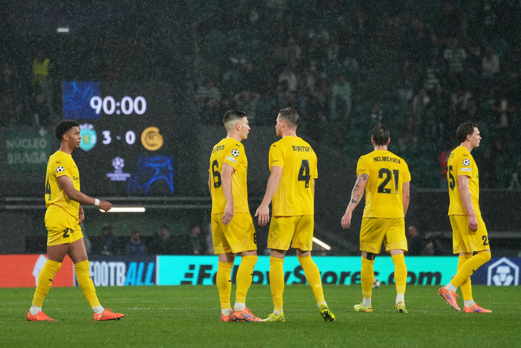 Bodo Glimt players react during a Champions League round of 16 second leg soccer match between Sporting CP and Bodo Glimt in Lisbon, Portugal, Tuesday, March 17, 2026. (AP Photo/Ana Brigida)