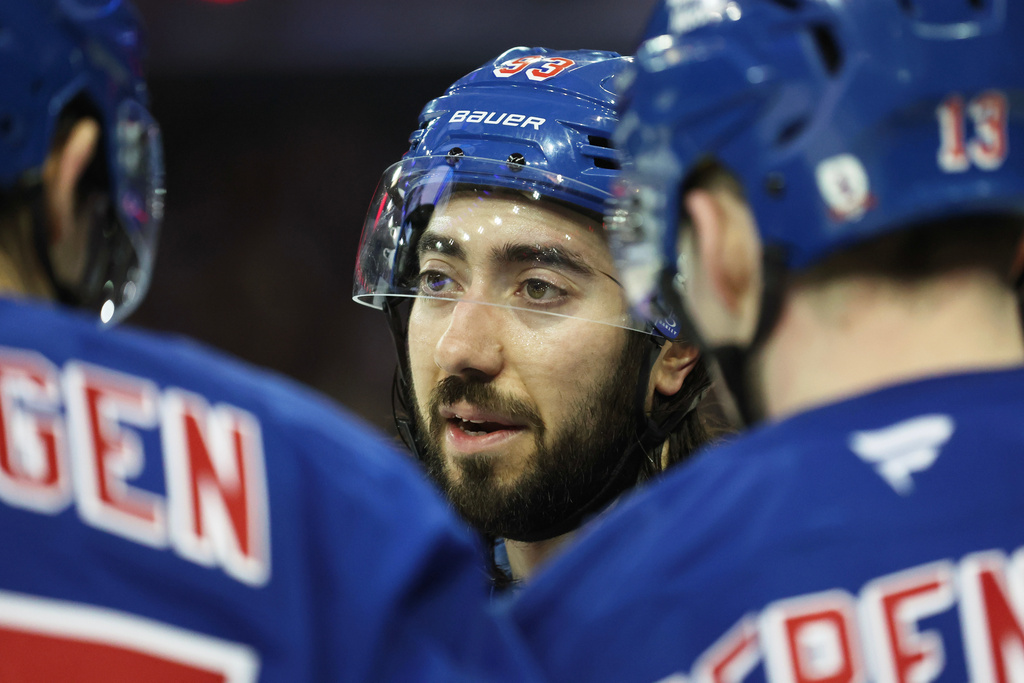 New York Rangers center Mika Zibanejad (93) speaks with teammates during the third period of an NHL hockey game against the Winnipeg Jets, Sunday, March 22, 2026, in New York. (AP Photo/Heather Khalifa)