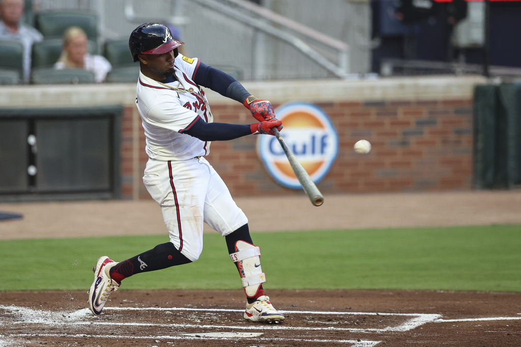 Atlanta Braves' Ozzie Albies hits a solo home run in the first inning of a baseball game against the Chicago Cubs, Monday, Sept. 8, 2025, in Atlanta. (AP Photo/Colin Hubbard)
