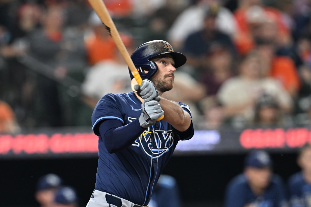 Tampa Bay Rays Brandon Lowe follows through on a solo home run against the Baltimore Orioles in the third inning of a baseball game, Wednesday, Sept. 24, 2025, in Baltimore. (AP Photo/Gail Burton)