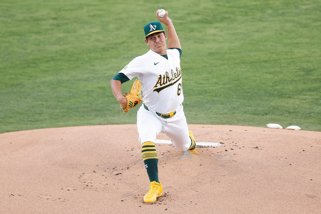 Athletics starting pitcher Gage Jump (61) throws during the first inning of a baseball game against the Colorado Rockies, Friday, June 12, 2026, in Las Vegas. (AP Photo/Caroline Brehman)