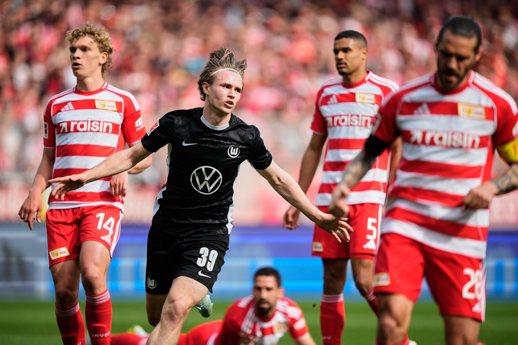 Wolfsburg's Patrick Wimmer celebrates his side's opening goal during the German Bundesliga soccer match between FC Union Berlin and Wolfsburg in Berlin, Germany, Saturday, April 18, 2026. (AP Photo/Ebrahim Noroozi)