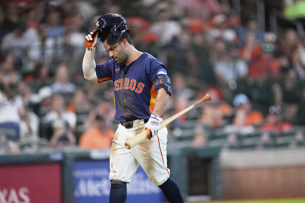 Houston Astros' Jose Altuve walks back to the dugout after striking out against the Baltimore Orioles during the fourth inning of a baseball game Sunday, Aug. 17, 2025, in Houston. (AP Photo/David J. Phillip)