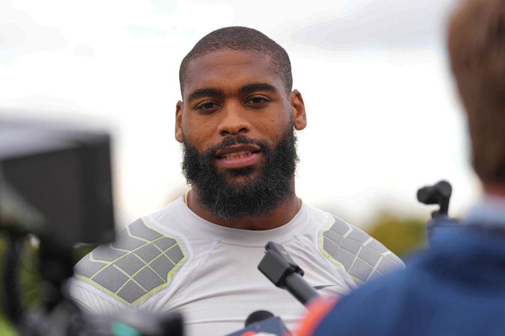 FILE - Denver Broncos' Jonathon Cooper speaks to the media at NFL football practice at Tottenham Hotspur training ground in London, Wednesday, Oct. 8, 2025. (AP Photo/Kirsty Wigglesworth, File)