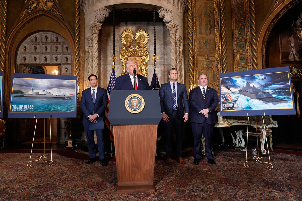 President Donald Trump speaks, with from left, Secretary of State Marco Rubio, Defense Secretary Pete Hegseth and Secretary of the Navy John Phelan,at his Mar-a-Lago club, Monday, Dec. 22, 2025, in Palm Beach, Fla. (AP Photo/Alex Brandon)