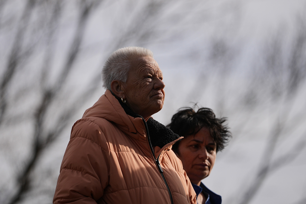 Fran Cooper, left, accompanied by her care giver Lily Bubjaku, waits in line durning an emergency food distribution at The Jewish Federation of Greater Philadelphia's Mitzvah Food Program in Philadelphia, Friday, Nov. 7, 2025. (AP Photo/Matt Rourke)