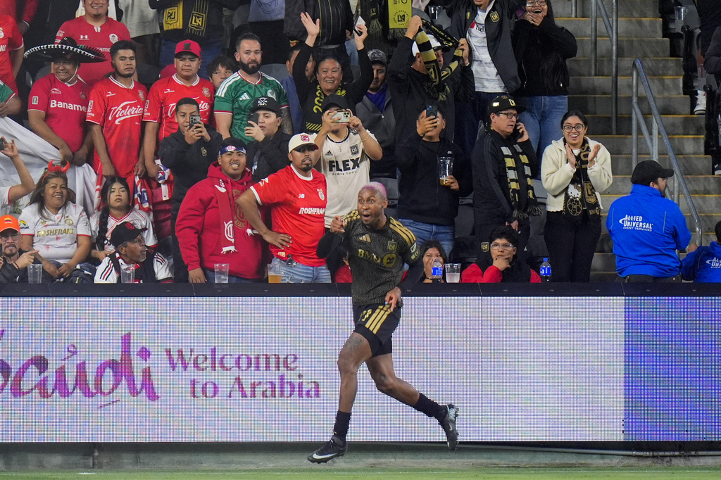 LAFC defender Nkosi Tafari celebrates his goal during the second half of the first leg of a CONCACAF Champions Cup semifinal soccer match against Toluca Wednesday, April 29, 2026, in Los Angeles. (AP Photo/Jae C. Hong)