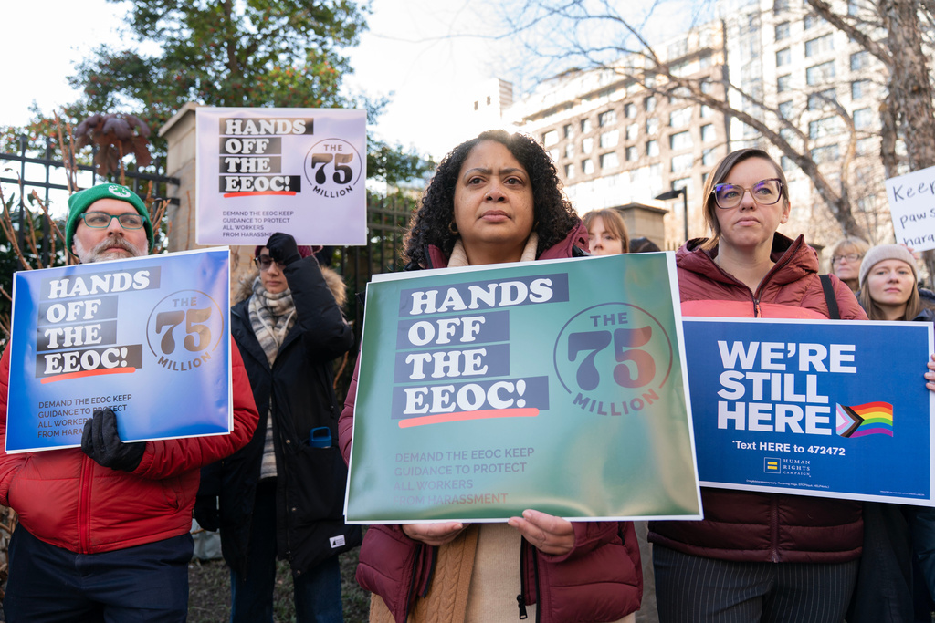 Members of the 75 Million coalition rally outside of the Equal Employment Opportunity Commission (EEOC) agency's headquarters Thursday, Jan. 22, 2026, in Washington, opposing the Equal Employment Opportunity Commission's move to rescind its 2024 Enforcement Guidance on Harassment in the Workplace. (AP Photo/Jose Luis Magana)