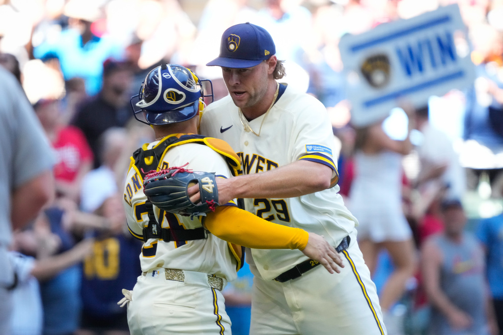 Milwaukee Brewers pitcher Trevor Megill (29) hugs William Contreras (24) after winning against the St. Louis Cardinals in a baseball game Wednesday, May 27, 2026, in Milwaukee. (AP Photo/Kayla Wolf)